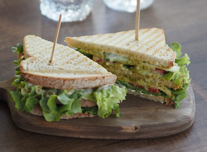 Club sandwich with cheese and pesto